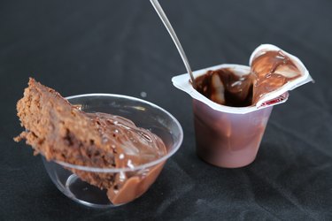 Scoop brownies into bowls