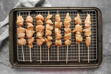 Thread chicken onto skewers