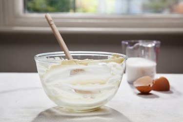 Empty mixing bowl, eggshells and milk