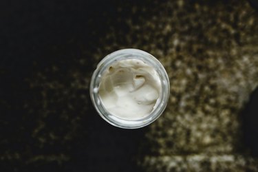 High Angle View Of Mayonnaise In Jar On Table