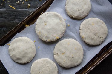 raw papusas on a baking sheet