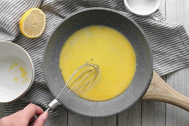 Whisk together egg yolks and lemon juice