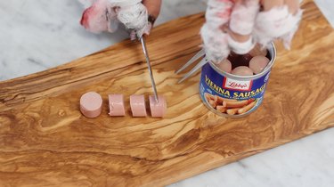 Slicing Vienna sausage