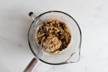 Whisk until the chocolate chunks are evenly incorporated throughout the dough.