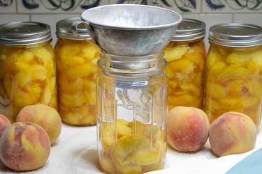 Even though fresh peaches are only available for a few months in the summer, there's no reason you can't enjoy them all year long. Just choose some fresh ripe peaches, grab a few jars, a little sugar, and you'll be on your way to preserving these delightful beauties in no time.