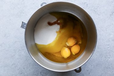 mixing bowl with wet ingredients and sugar