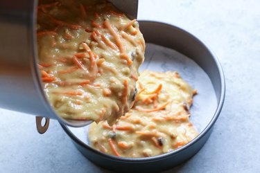 Pouring cake batter into cake pan