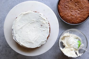 Frosted cake on a cake stand