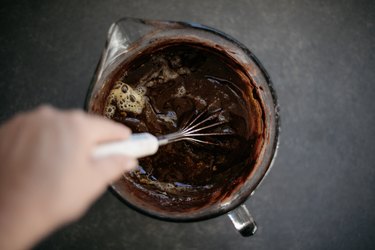 Whisk in the melted butter and water until smooth and evenly combined.