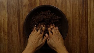 Pressing no-roll gluten-free low-carb almond flour chocolate pie crust into pie pan.