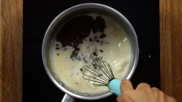 Heating heavy cream and powdered sweetener for low carb truffles.