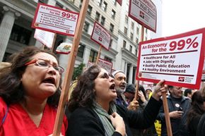 Protesters gather in front of Wells Fargo headquarters in San Francisco as part of the Occupy Wall Street movement. See more protesting pictures.