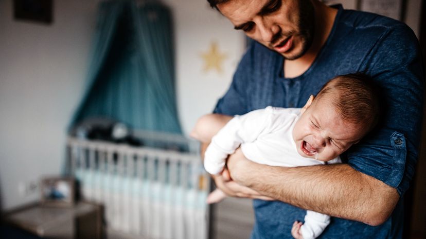 dad with crying baby